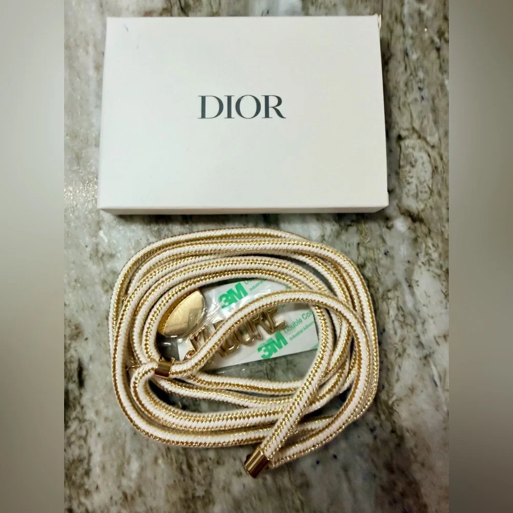 Dior J’adore Phone Strap with Charms. Measures 22” long. New in Box. Sealed